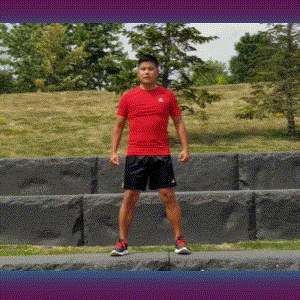 A man doing squats in the park.