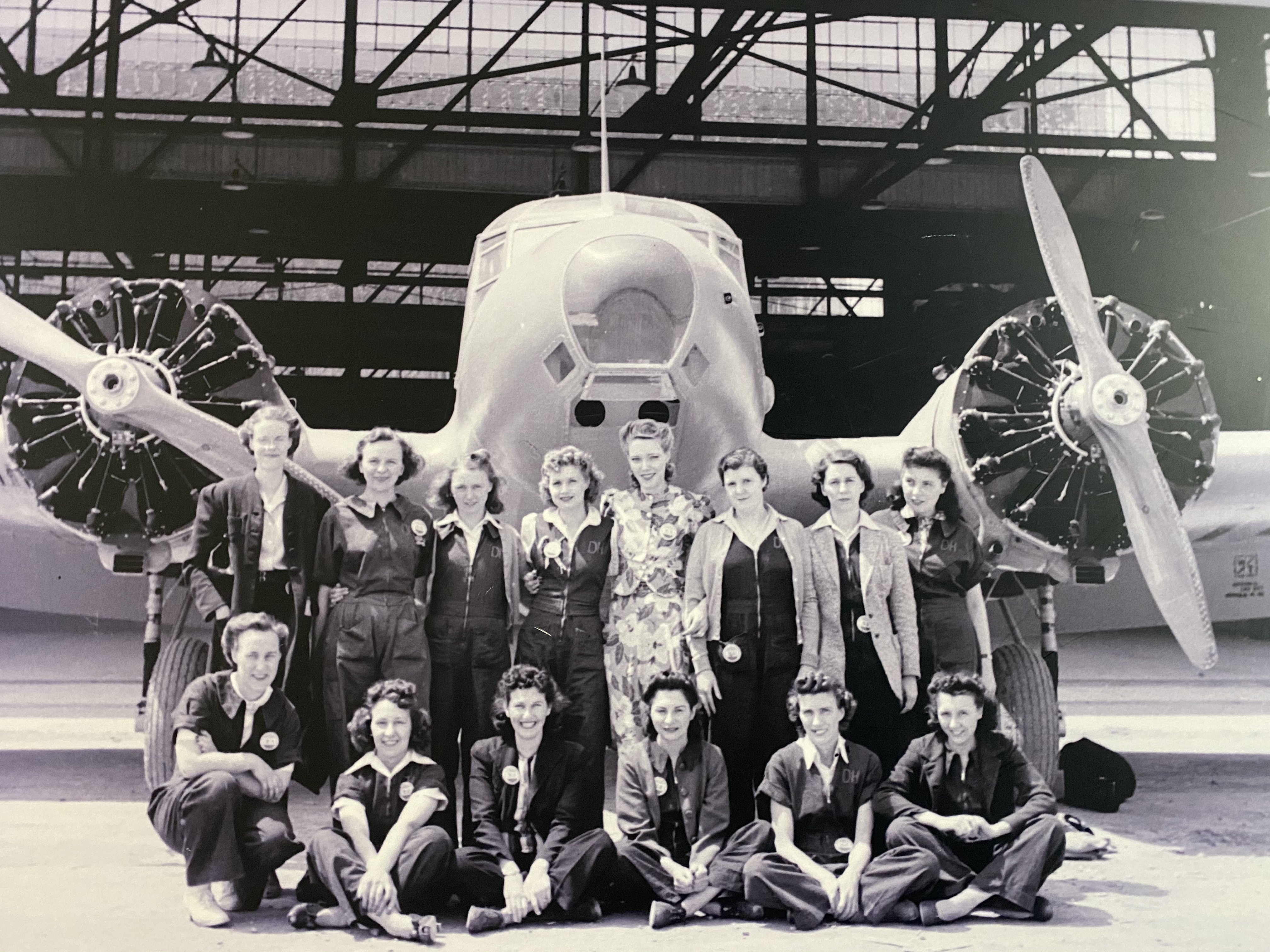 Group of people in front of plane
