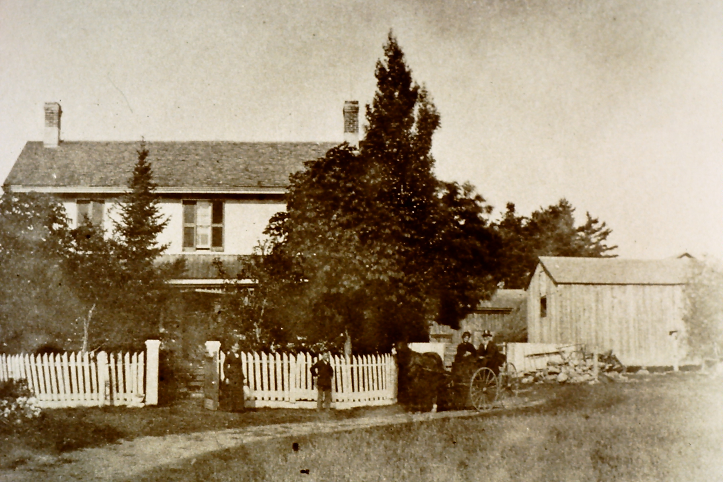 Old image of house, car and people