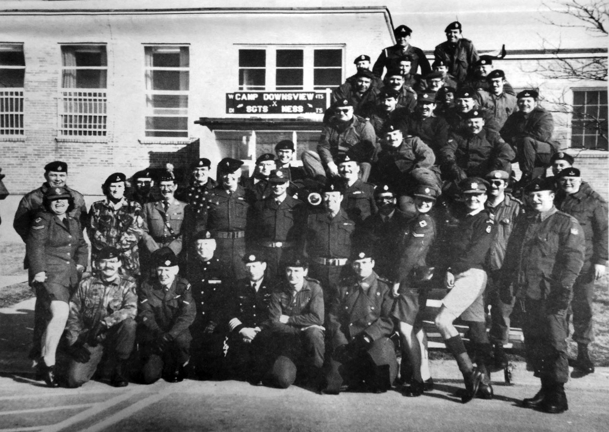 A black and white photo of a group of military personnel.