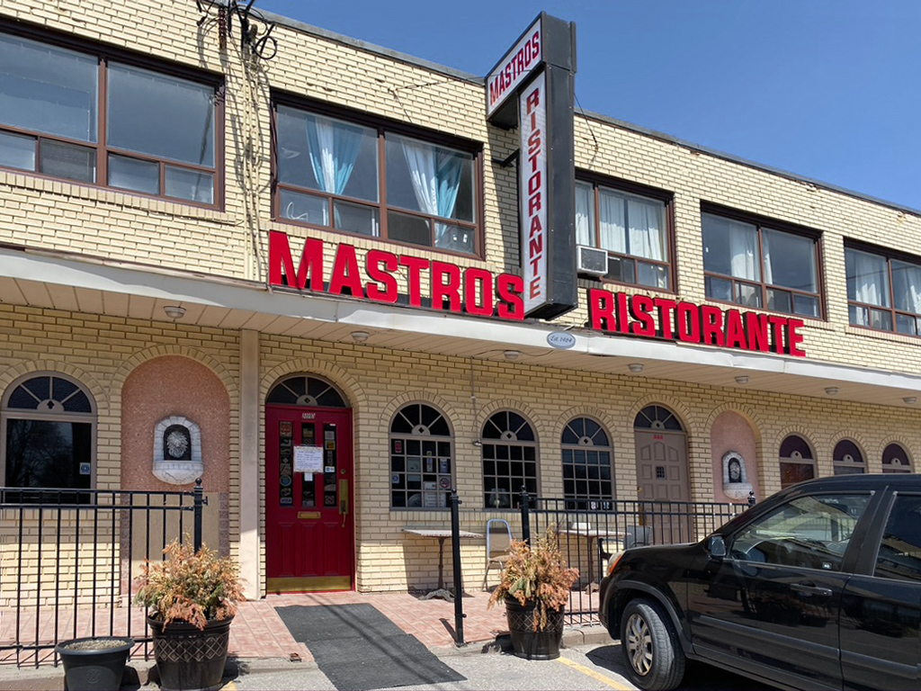 A restaurant with a sign that says "Mastros Ristorante."