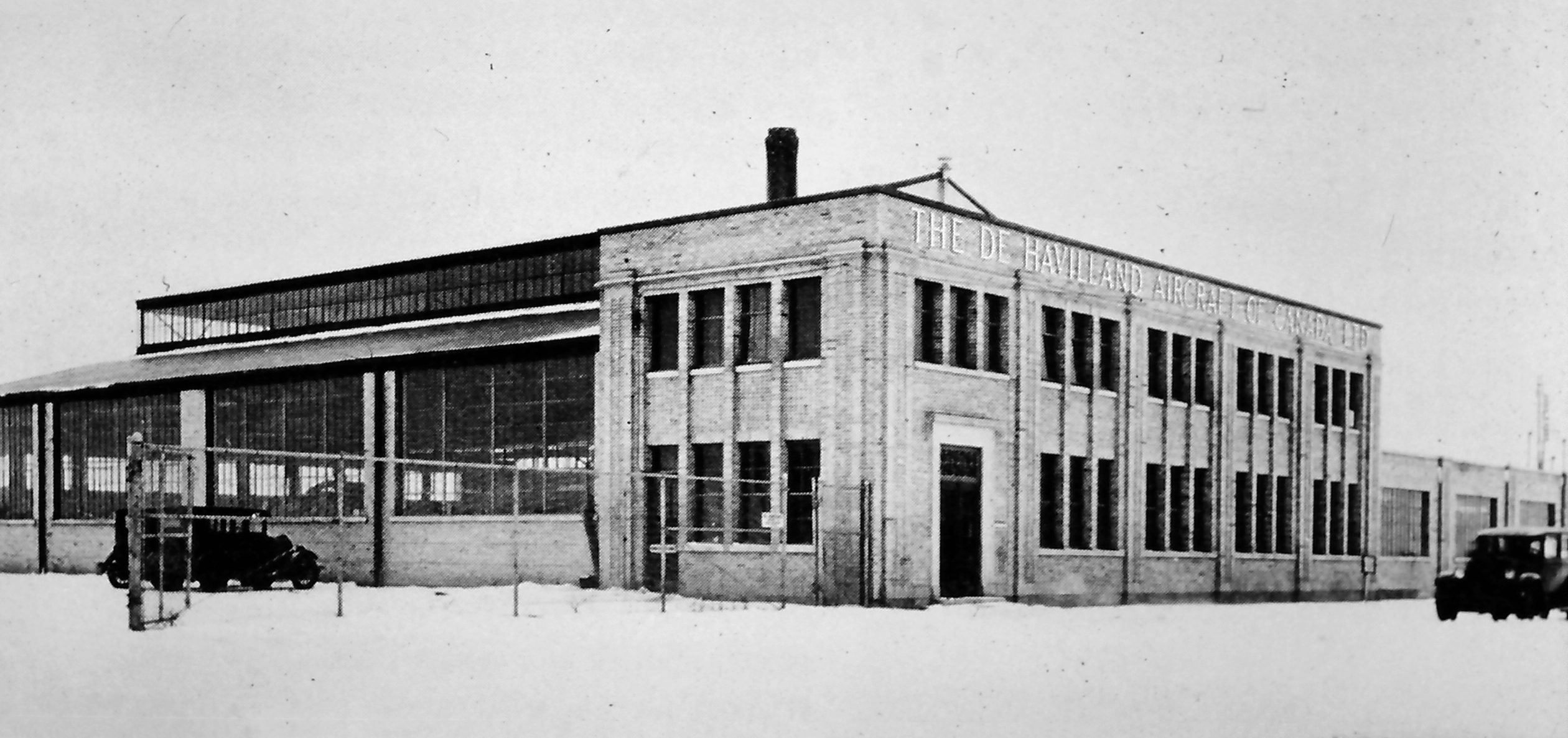 A black and white photo of a building that says &quot;The de Havilland Aircraft of Canada ltd.&quot;
