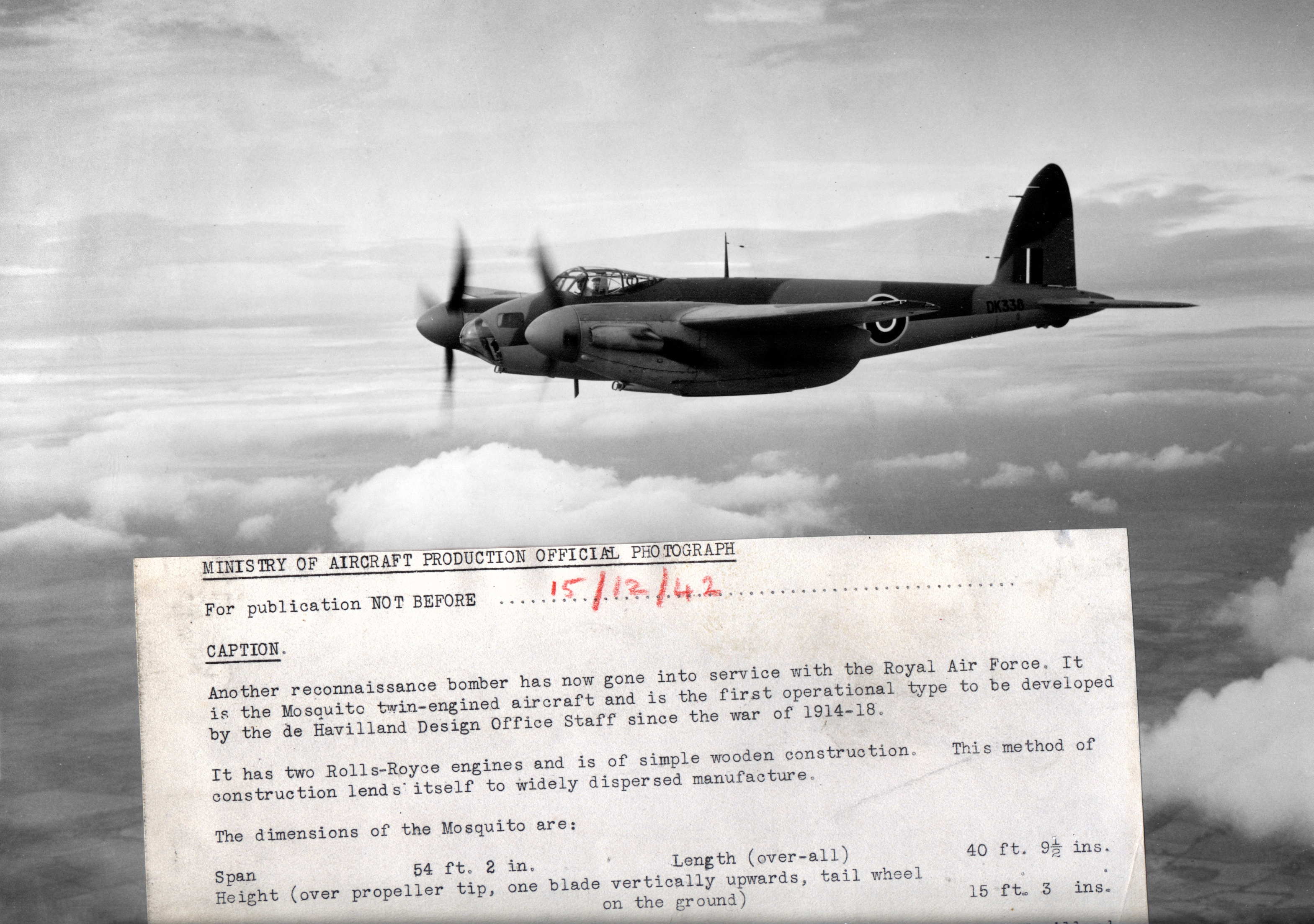 A black and white photo of a de Havilland Mosquito aircraft in flight.