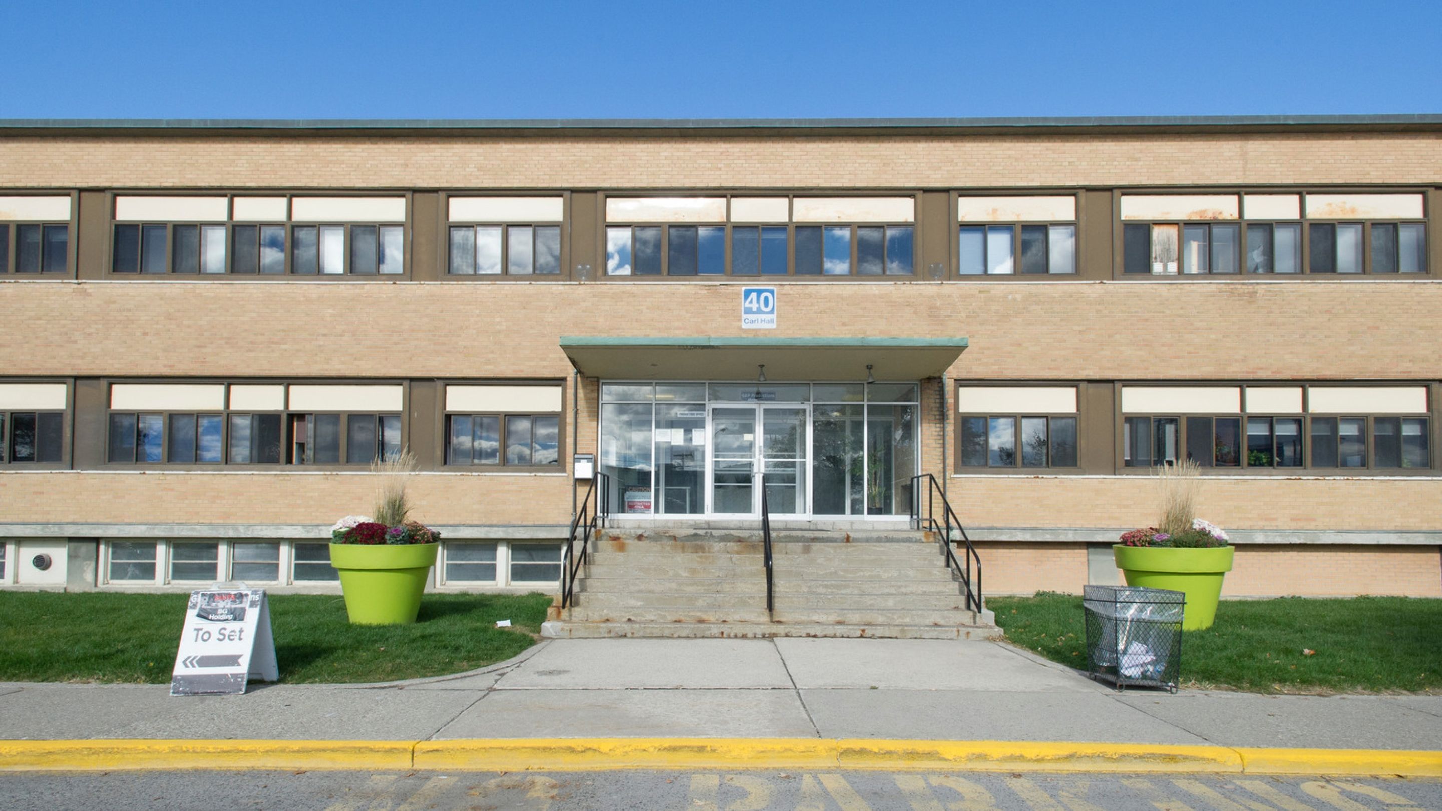 A beige building along Carl Hall Road.