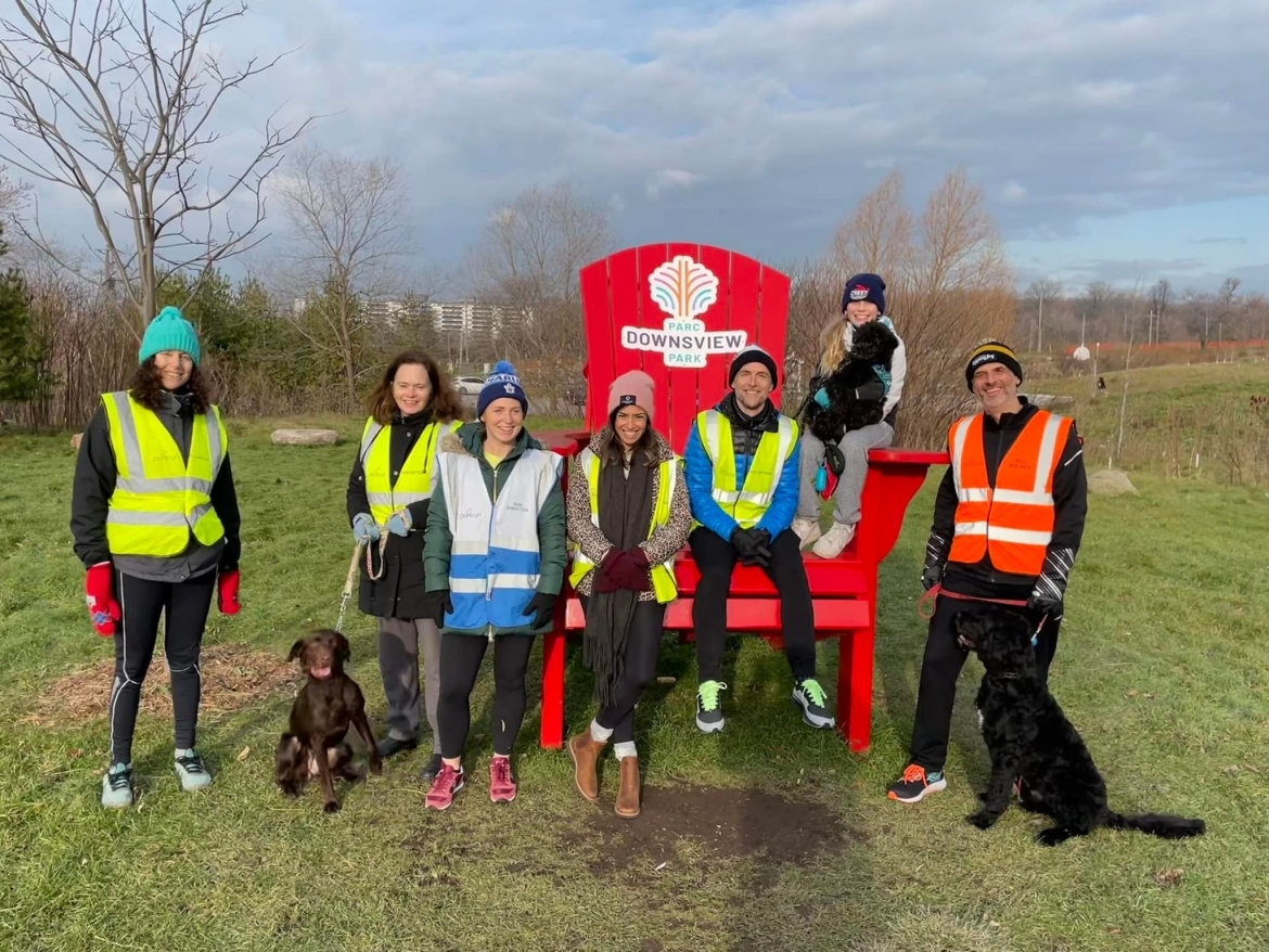 Downsview parkrun participants sitting on a giant Muskoka chair.