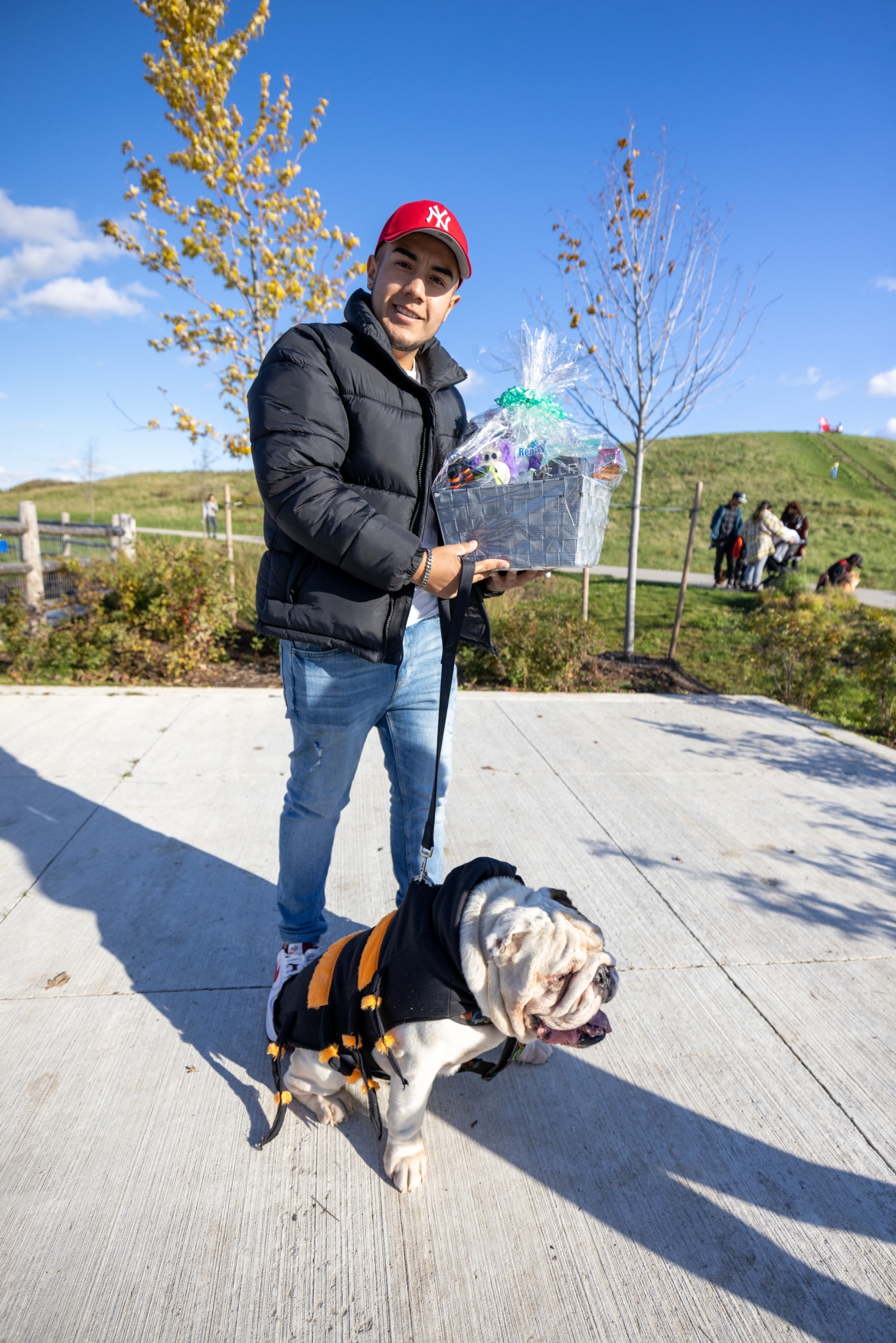 A prize winner posing with his dog.