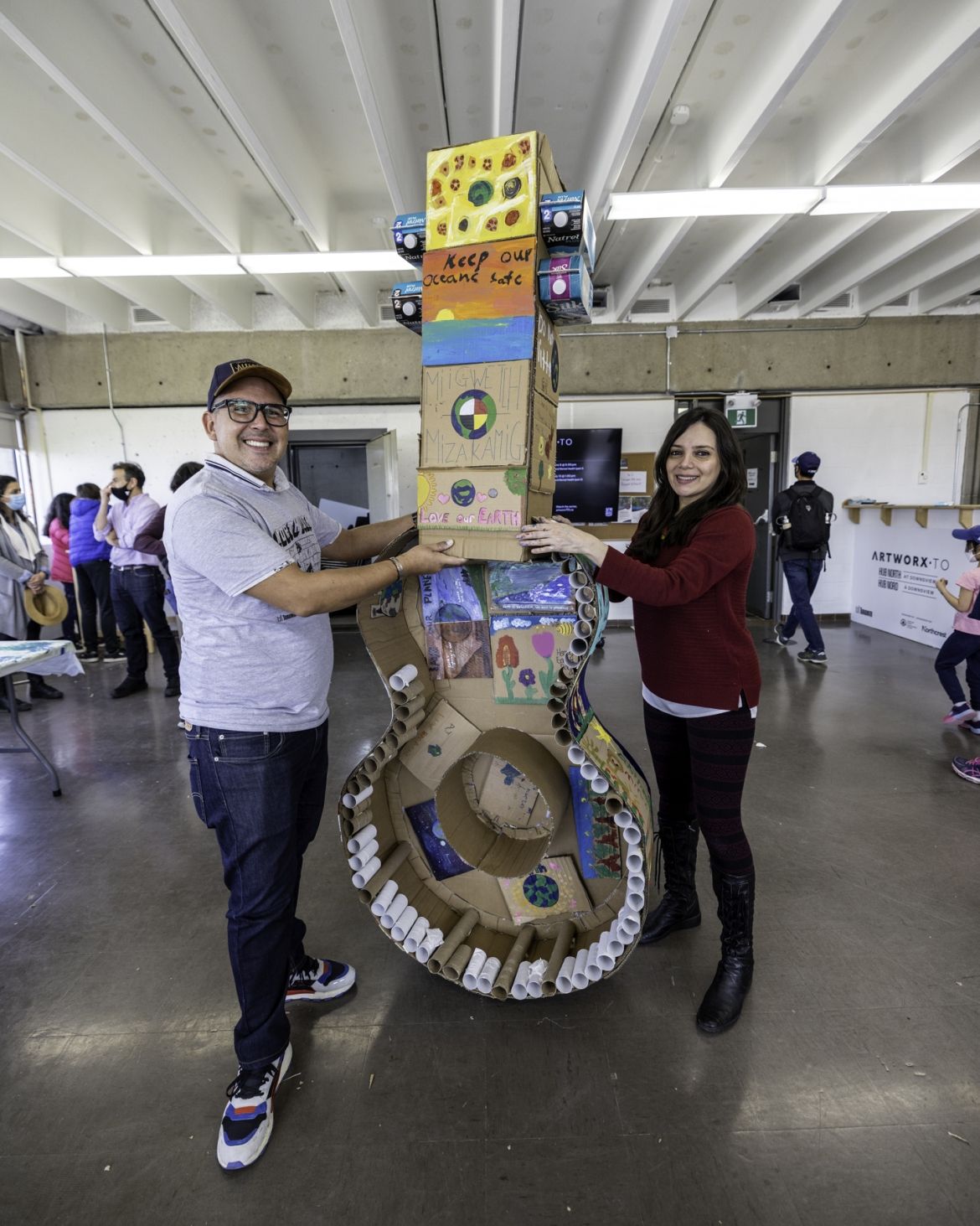 North York Arts' completed upcycled art piece, a giant cardboard guitar.