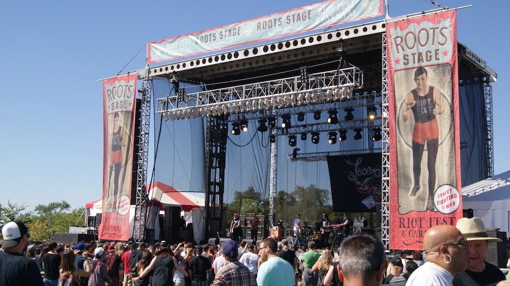A large Riot Fest stage and a crowd of people.