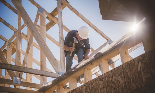 someone building a house