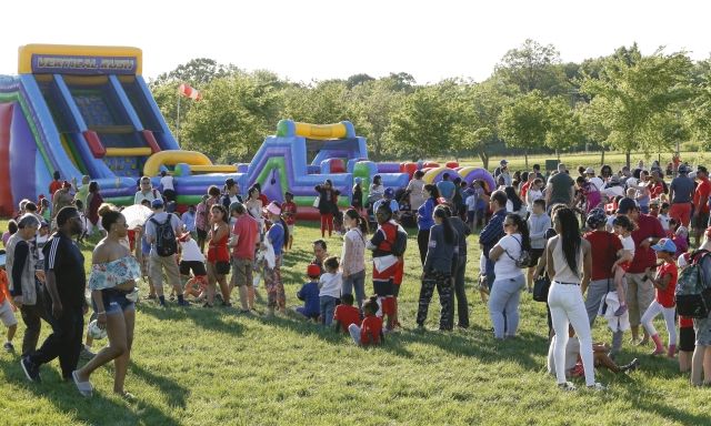 Canada Day 2019 Crowd of people in line for inflatables
