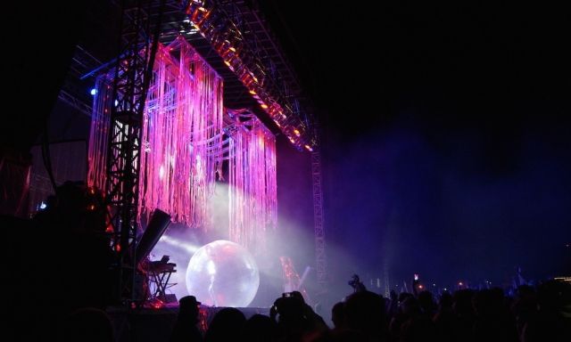 A large VELD stage featuring colourful spotlights and streamers.