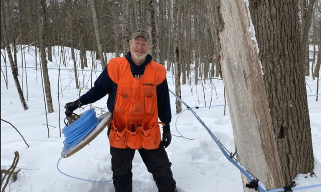 Person holding wire in the snowy outdoors