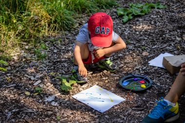 toddler looking at the ground