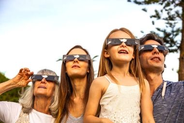people wearing eclipse glasses