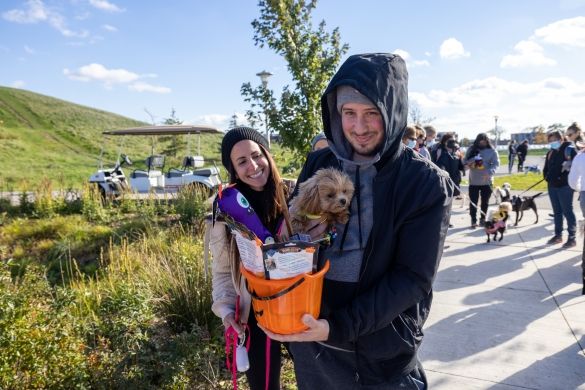 Prize winners posing with their dog.