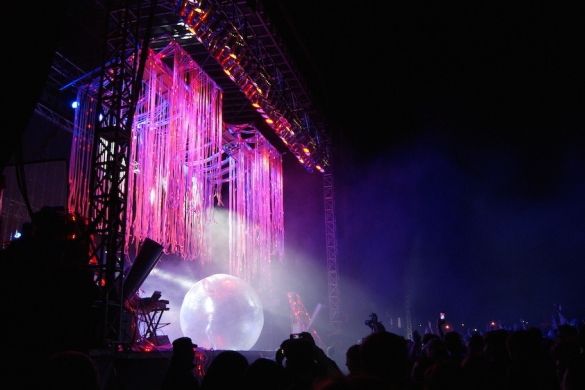 A large VELD stage featuring colourful spotlights and streamers.