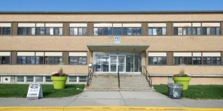 A beige building along Carl Hall Road.