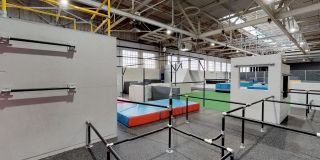 Bars, mats and more at an indoor parkour gym.